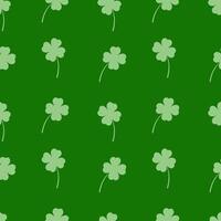 Seamless pattern with clover leaves on a green background vector