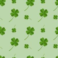 Seamless pattern with clover leaves on a green background vector