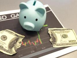 Piggy bank investment with a graph of investment returns in the background. Concept for financial security and savings. photo