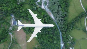 plane flies above the landscape. Side view of aircraft. Travel and transportation concept. photo