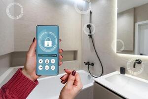 All the house in a phone. Close up of young woman user hands controlling electronic objects in modern luxury studio apartment via smart home interface on cell screen. Internet of things ios technology photo