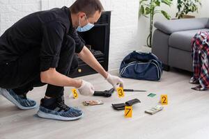 Forensics researcher photographing a blood at a murder scene photo
