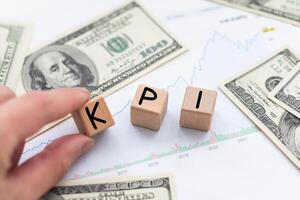 Key Performance Indicator concept. text KPI, written on wooden cubes on white background, business planning and measure success, target achievement. photo