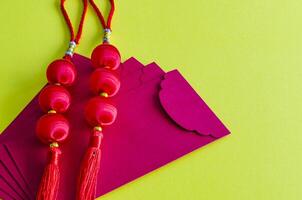 Chinese New Year lanterns on top of red packets on yellow cover background. Chinese New Year celebration photo