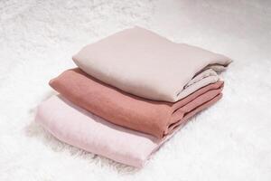 Hijab pile in soft colors, isolated on a white background. Hijab mockup with high-resolution photos
