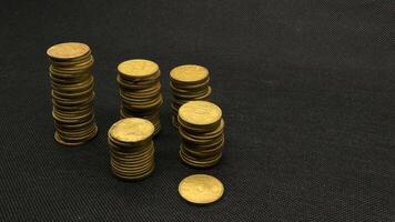Stack of five hundred rupiah yellow Indonesian coins photo