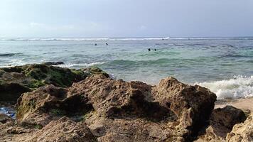 Beautiful view on suluban beach with big rocks in bali photo