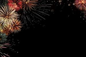 New Year's background with colorful fireworks lighting up the sky, leaving room for copy below photo