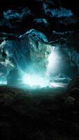 blue ice cave covered with snow and flooded with light video