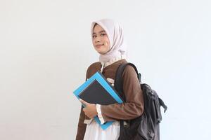 Confident Muslim Student Girl with Backpack and Books Ready for Class photo