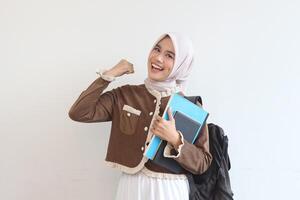 Confident Muslim Student Girl Posing with Books and Backpack Ready for Class photo