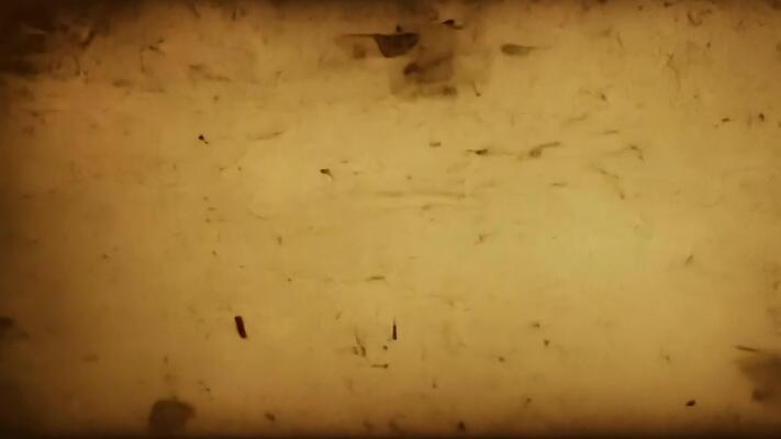 Flickering light emerges from an old film burning in a projector, creating  a nostalgic atmosphere of vintage cinema