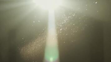 Light beams shining through dust particles create a captivating effect against a dark background, enhancing visual depth video