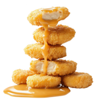 Stack of delicious golden chicken nuggets with creamy sauce dripping down. png