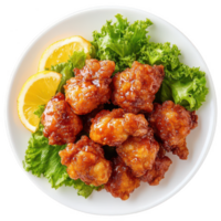 Delicious crispy chicken bites garnished with lettuce and lemon slices. png