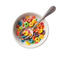 Colorful cereal in a bowl with a spoon, perfect for a cheerful breakfast setting. png