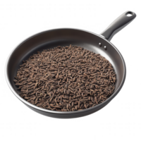 A close-up of a frying pan filled with aromatic cumin seeds ready for cooking. png