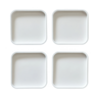 A set of four empty white square plates arranged neatly on a plain surface. png