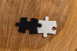 puzzle pieces, black and white, concept of unity between opposites photo