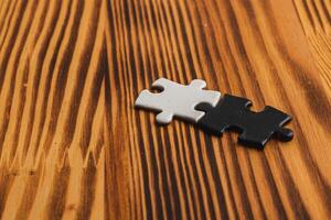 puzzle pieces, black and white, concept of unity between opposites photo