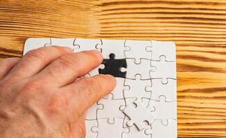 Choosing the correct option, against a black and white puzzle background photo