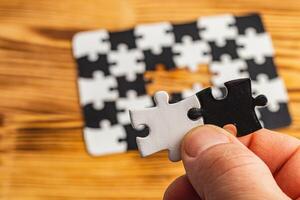 Choosing the right option. Conceptual image using a black and white puzzle photo
