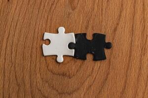 puzzle pieces, black and white, concept of unity between opposites photo