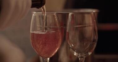 Anonymous person pouring sparking wine into glass video