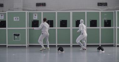 Diverse fencers practicing with targets video