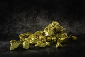 Natural gold nugget with dark background photo