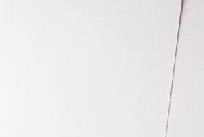 White paper texture with a satin sheen and subtle pearlescent gradient. The sleek surface features photo