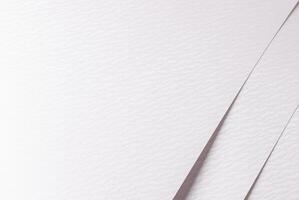 White paper texture with a soft, smooth surface and subtle pearlescent lines. The neutral, photo