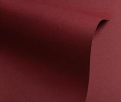 Elegant paper texture with a wavy gradient in deep marsala and brick red hues. Featuring a matte, photo