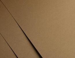 Golden brown paper texture with a matte, grainy surface in chamois tones. The rustic yet smooth photo