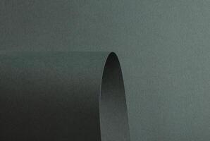 Green paper texture with a wavy embossed pattern in dark green and deep teal tones. Featuring a photo