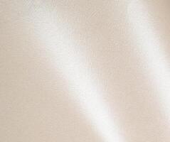 Ivory champagne paper texture with a luminous pearl-like sheen and smooth, fibrous surface. The warm photo