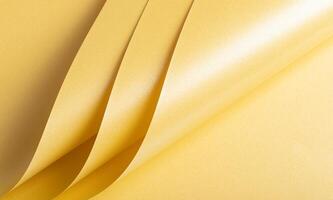 Pale gold paper texture with a soft, creamy yellow finish and subtle amber highlights. The glossy, photo
