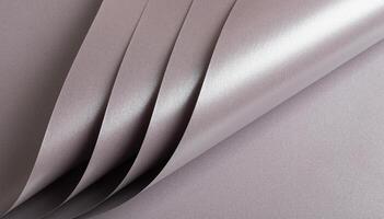 Soft gray paper texture with a metallic, glossy finish in taupe, sepia, and grayish pink with a photo