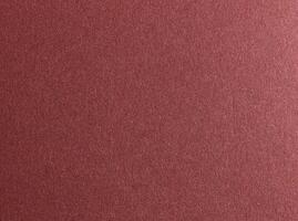 Burgundy red metallic paper texture with a glossy satin finish and subtle gradient. The warm photo