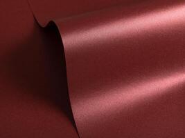 Burgundy red metallic paper texture with a pearlescent sheen and wavy shapes. The glossy satin photo