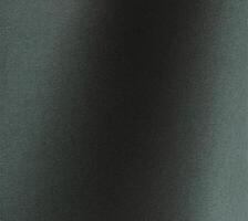 Dark green paper texture with an embossed wavy leather like pattern in forest green and deep teal photo