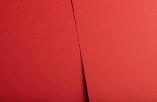 Red paper background. Smooth and textured surface with a vintage and modern style, perfect for photo