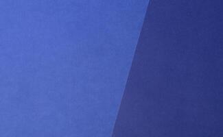 Royal blue tracing paper background with a matte finish and soft gradient. The translucent, grainy photo