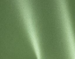 Luxurious green paper background with a smooth satin finish and rich metallic sheen. The monochrome photo