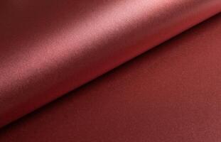 Burgundy red metallic paper texture with a pearlescent sheen and warm red-brown tones. The smooth, photo