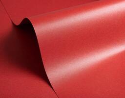 Luxurious red paper background with a vibrant ruby tone and glossy satin finish. Smooth and photo