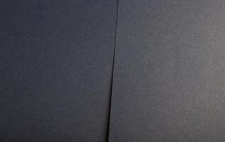 Luxurious navy paper background with a muted blue gradient and subtle grainy texture. Matte and photo