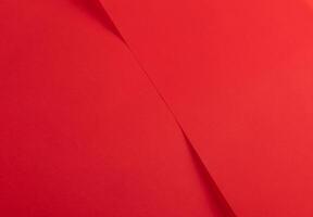 Elegant red scarlet paper background with a smooth texture and vibrant gradient. Featuring a rich photo