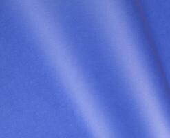 Elegant royal blue paper background with a matte finish and subtle grainy texture. Featuring a soft photo