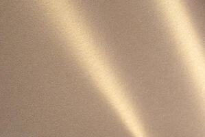 Luxurious paper background with a soft monochrome gradient in warm taupe and champagne tones. Smooth photo